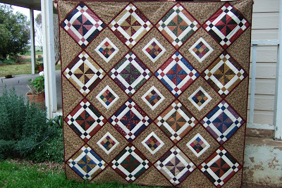 Whirlygig quilt done in scrappy